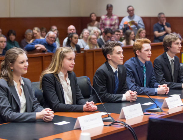 A high school Mock Trial team performs in the courtroom.